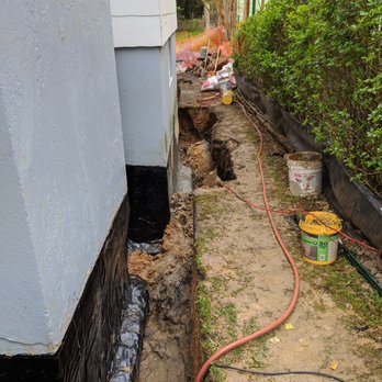 Pipe & Stone - a hole in the side of a house - Waterproofing Near Me - Silver Spring, Maryland