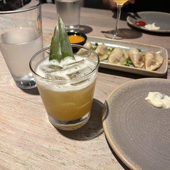 Moku Kitchen - Golden hour (drink) , pork potstickers, luche libre (drink) - Cocktail Bars Near Me - Honolulu, Hawaii Moku Kitchen - Golden hour (drink) , pork potstickers, luche libre (drink) - Cocktail Bars Near Me - Honolulu, Hawaii