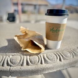 It's a nice day to have coffee and a pastry outdoors.