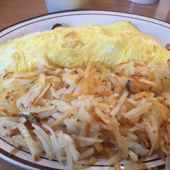 Camm Cafe - an omelet and hash browns on a plate - American Near Me - Croswell, Michigan