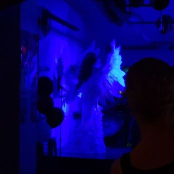 The Drink - a woman in a white dress in a dark room - Coffee & Tea Near Me - Toronto, Ontario