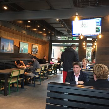Shake Shack Seaport - Inside (goes around the corner) - Burgers Near Me - Boston, Massachusetts Shake Shack Seaport - Inside (goes around the corner) - Burgers Near Me - Boston, Massachusetts