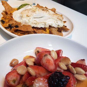 Sava's - Brunch - Chilaquiles with chorizo add-on and seasonal fruit with honey. - Bars Near Me - Ann Arbor, Michigan Sava's - Brunch - Chilaquiles with chorizo add-on and seasonal fruit with honey. - Bars Near Me - Ann Arbor, Michigan
