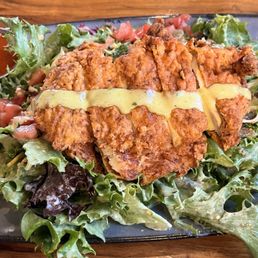 Fried Chicken salad with spicy aioli in the side Fried Chicken salad with spicy aioli in the side