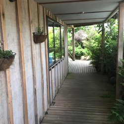National Park Backpackers - Deck leading to a few of the private rooms.