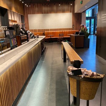 Starbucks - a view of a coffee shop with tables and benches - Coffee & Tea Near Me - Bellevue, Washington
