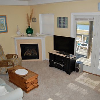 Lighthouse View - Living Room, Front Door, main deck. - Vacation Rentals Near Me - Chincoteague Island, Virginia