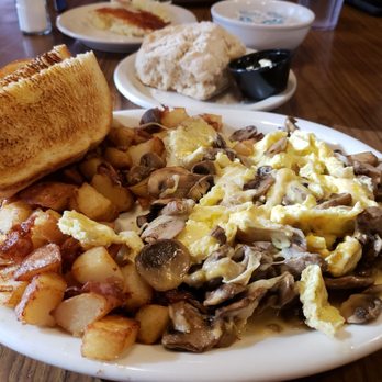 Deja Vu - Mushroom and cheese omelet with home fries and toast with a fresh made biscuit in the background. - Breakfast & Brunch Near Me - Redding, California