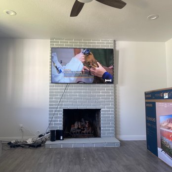 JR Mounting - 65" mounted on brick fireplace with tilt - TV Mounting Near Me JR Mounting - 65" mounted on brick fireplace with tilt - TV Mounting Near Me