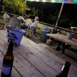 a beer on a picnic table a beer on a picnic table