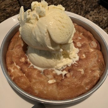 BJ's Restaurant & Brewhouse - White Chocolate Macadamia Nut Pizookie - Pizza Near Me - Eugene, Oregon BJ's Restaurant & Brewhouse - White Chocolate Macadamia Nut Pizookie - Pizza Near Me - Eugene, Oregon