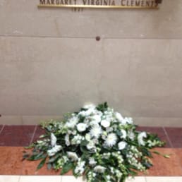 The day we put Papa in and his casket spray.