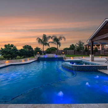 Luxe Outdoors - a pool and patio at dusk - General Contractors Near Me - Cypress, Texas Luxe Outdoors - a pool and patio at dusk - General Contractors Near Me - Cypress, Texas