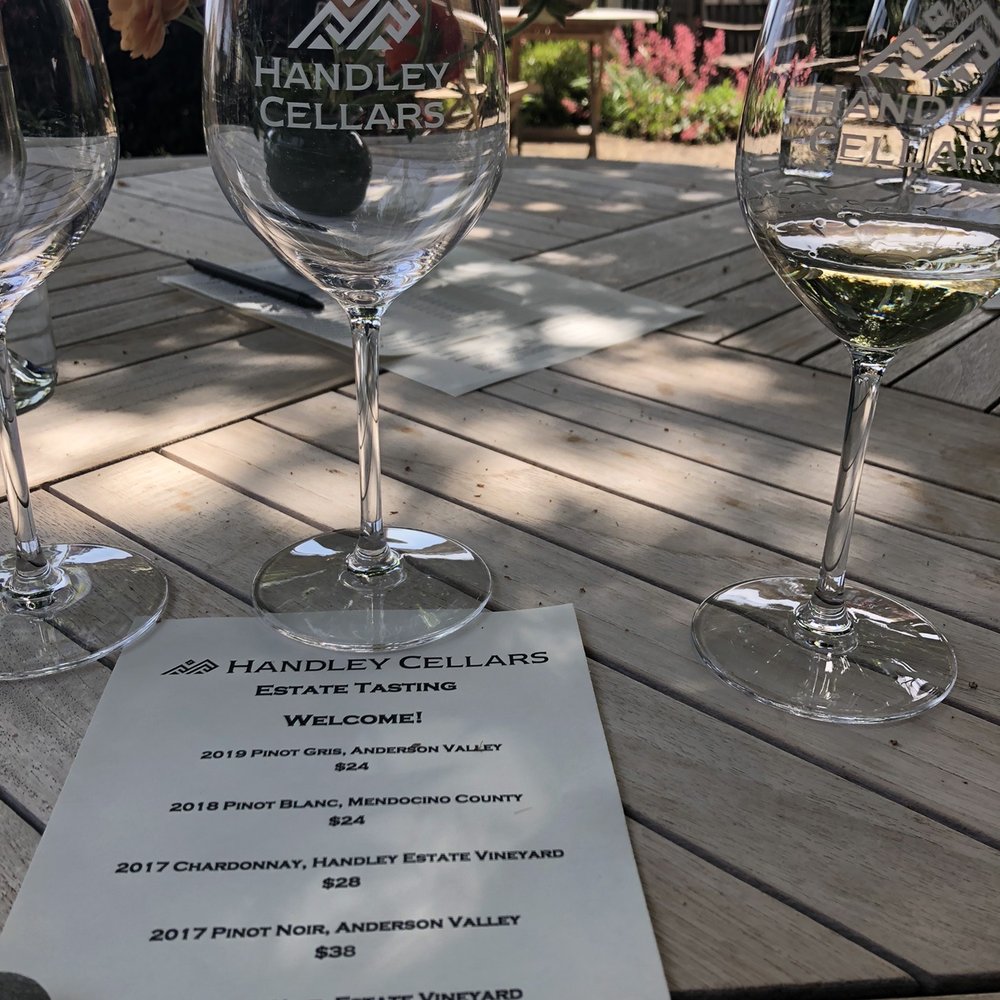 Handley Cellars tasting menu, glasses on the patio. Handley Cellars tasting menu, glasses on the patio.