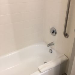 Clean bathroom with tub