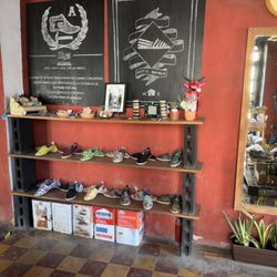 Tags - Display of shoes and arts. You can order more online.