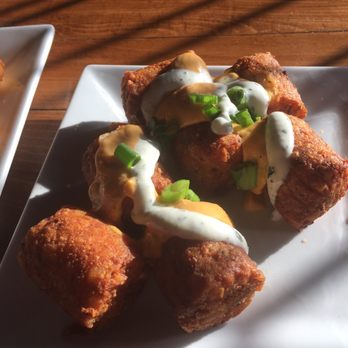 Checkered Flag Tavern - Bacon & cheese stuffed tater tots - Pubs Near Me - Indianapolis, Indiana Checkered Flag Tavern - Bacon & cheese stuffed tater tots - Pubs Near Me - Indianapolis, Indiana