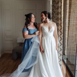 Wedding dress down (hemmed by Mouna) and blue dress is altered with a lace up back Wedding dress down (hemmed by Mouna) and blue dress is altered with a lace up back