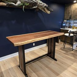 Reclaimed Enterprises - Bar Table - live edge walnut top with walnut inlays for steel base ends.