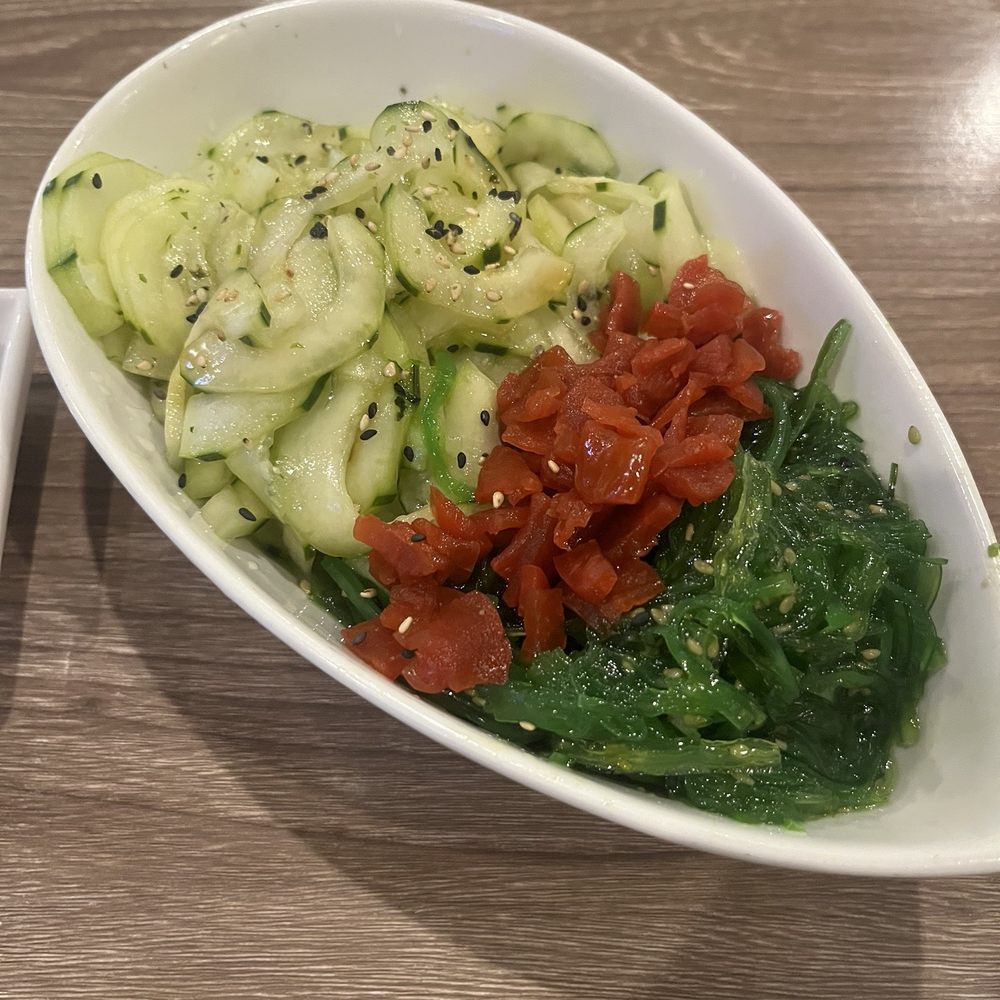 Nice portion of cucumber salad which includes some seaweed salad too Nice portion of cucumber salad which includes some seaweed salad too