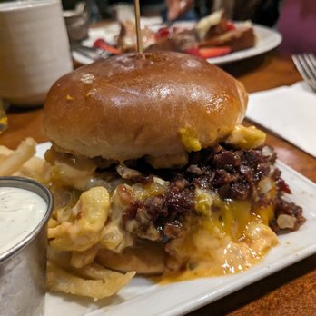 Pyramid Cafe - Mac and cheeseburger comes topped with generous portions of saucy crispy candied bacon bits with fries and ranch dressing for dipping. - Burgers Near Me - Las Vegas, Nevada Pyramid Cafe - Mac and cheeseburger comes topped with generous portions of saucy crispy candied bacon bits with fries and ranch dressing for dipping. - Burgers Near Me - Las Vegas, Nevada