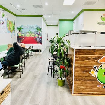 Coconut & Co - a woman sitting at a desk with a laptop - Bubble Tea Near Me - Alhambra, California