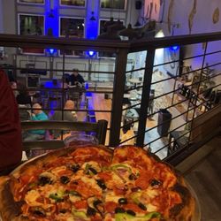 Pioneer Tap House - Supreme pizza. Upstairs view of stage.