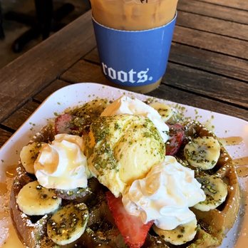 Roots Cafe - Iced hazelnut latte with oat milk. Matcha waffle with bananas and strawberries. - Cafes Near Me - Cerritos, California