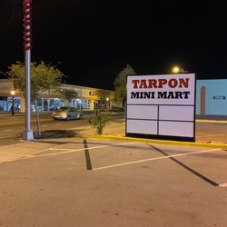 Tarpon Mini Mart And Smoke Shop - Street sign