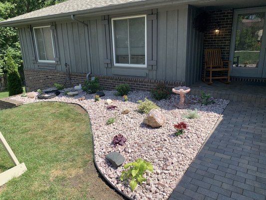 New Rock Garden - This landscape revival included the following:
- Mulch Removal
- Old plants/bushes removal
- New Weed barrier installed
- New Rock Installed
- New Plants Installed
- New Edging Installed New Rock Garden - This landscape revival included the following:
- Mulch Removal
- Old plants/bushes removal
- New Weed barrier installed
- New Rock Installed
- New Plants Installed
- New Edging Installed