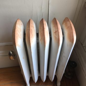 Ridea Painting - Rusty radiator with wall damage - Painters Near Me - San Francisco, California Ridea Painting - Rusty radiator with wall damage - Painters Near Me - San Francisco, California