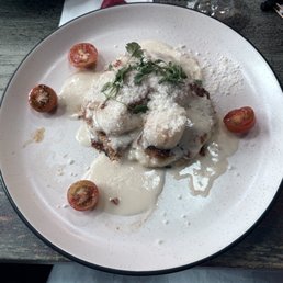 Scallops over quinoa (?) pancake with cream sauce. Scallops over quinoa (?) pancake with cream sauce.