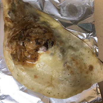 Rizzotto's Pizzeria - Half cooked calzone. - Italian Near Me - Largo, Florida Rizzotto's Pizzeria - Half cooked calzone. - Italian Near Me - Largo, Florida