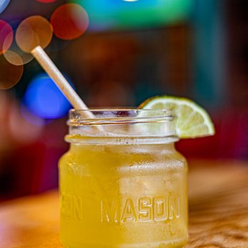 Local Cantina - Upper Arlington - a mason jar with a straw and a lime slice - Tex-Mex Near Me - Columbus, Ohio Local Cantina - Upper Arlington - a mason jar with a straw and a lime slice - Tex-Mex Near Me - Columbus, Ohio