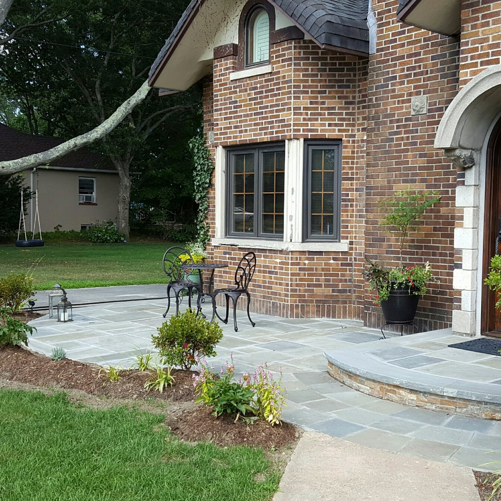 Kelly Brothers Landscaping - the front of a brick house - Landscaping Near Me - Coram, New York