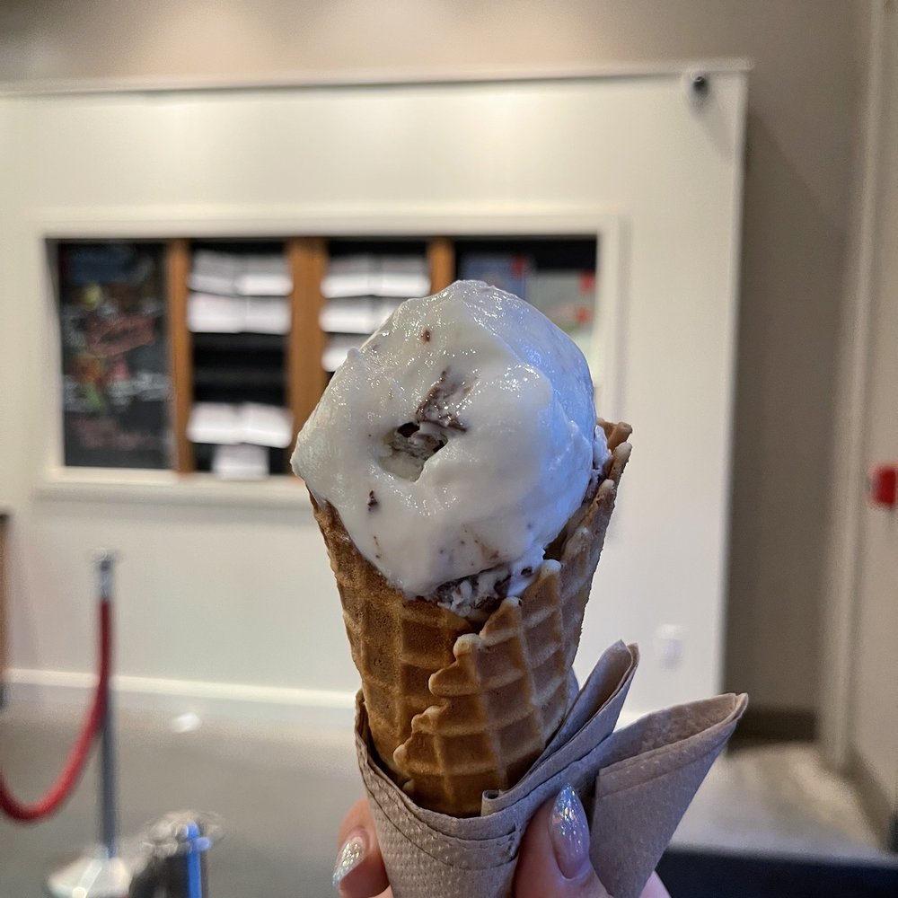 Lick Honest Ice Creams - a hand holding a cone of ice cream - Ice Cream & Frozen Yogurt Near Me - Austin, Texas