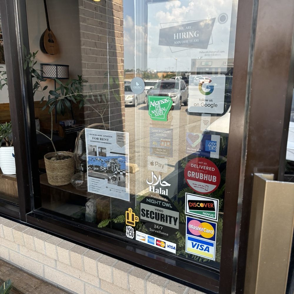 Pella Cafe - Outside -also  photo of a sticker of their sister location on Main Street - Mediterranean Near Me - Jonesboro, Arkansas