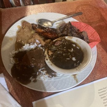 Hoover's Cooking - Plate with brisket taco, étouffée, gumbo and BBQ wings - Southern Near Me - Austin, Texas Hoover's Cooking - Plate with brisket taco, étouffée, gumbo and BBQ wings - Southern Near Me - Austin, Texas