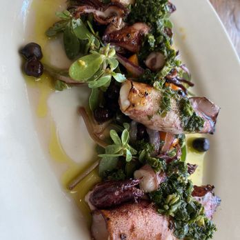 Gjelina - Grilled Local Grilled Squid , Lima Bean , Frisee , Cherry Tomato & Black Olive Tapenade - New American Near Me - Venice, California Gjelina - Grilled Local Grilled Squid , Lima Bean , Frisee , Cherry Tomato & Black Olive Tapenade - New American Near Me - Venice, California