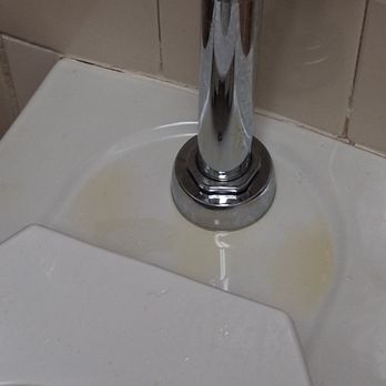 Bascom Palmer Eye Institute - A toilet in a coed restroom - Ophthalmologists Near Me - Miami, Florida