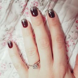 Black cherry berry with gold streaks on the tips with squoval shape.