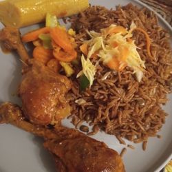 Roseline Family Food Market And Take Out Restaurant - Brown Stew Chicken dirty rice with chicken gravy boiled banana and veggies