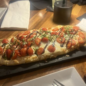 The Hangry Bison - Flatbread Capris tomatoes , cheese and basil sauce - Burgers Near Me - Winter Garden, Florida The Hangry Bison - Flatbread Capris tomatoes , cheese and basil sauce - Burgers Near Me - Winter Garden, Florida