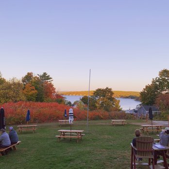 Craft Beer Xchange - a group of people sitting at picnic tables - Pubs Near Me - Laconia, New Hampshire