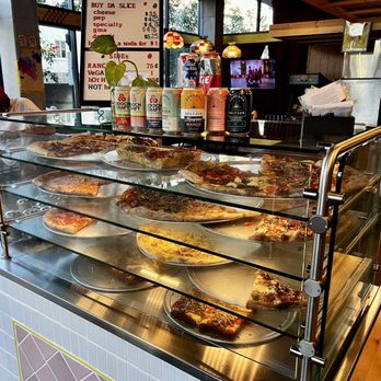 TNT Pizza - Per slice selection near register - Pizza Near Me - San Diego, California TNT Pizza - Per slice selection near register - Pizza Near Me - San Diego, California