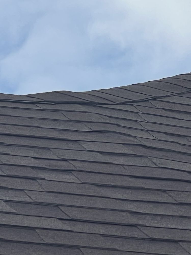 Slide of Tucker Roofing Systems