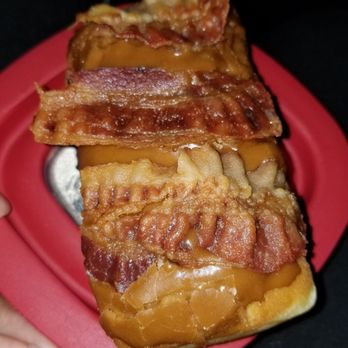 Jupiter Donuts Royal Palm - About half of my maple bacon donut. - Donuts Near Me - Royal Palm Beach, Florida