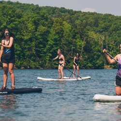 Float Eureka - Try stand up paddle boarding when you visit Eureka Springs this summer!