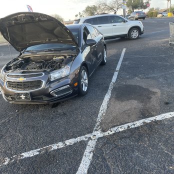 Midway Chevrolet - Cap is the small fit in right of picture above horizontal parking line - Car Dealers Near Me - Phoenix, Arizona