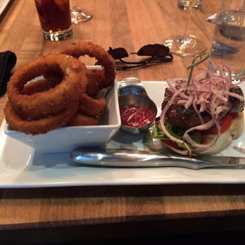 Chop Steakhouse & Bar - Steak sandwich with onion rings - Steakhouses Near Me - Calgary, Alberta Chop Steakhouse & Bar - Steak sandwich with onion rings - Steakhouses Near Me - Calgary, Alberta